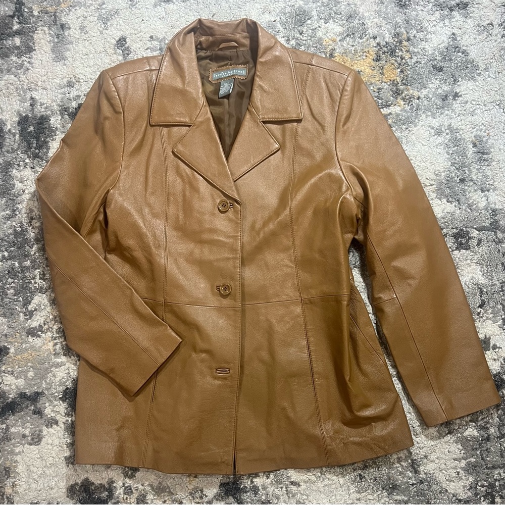 How could you not want this leather blazer? Step out with this rare blazer.